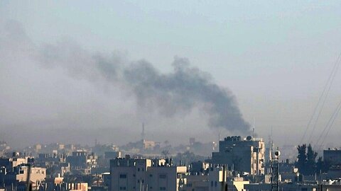 Smoke billows following Israeli strikes on Khan Yunis, seen from Rafah