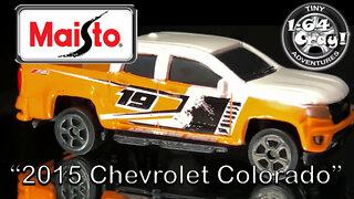 “2015 Chevrolet Colorado” in Orange/White- Model by Maisto