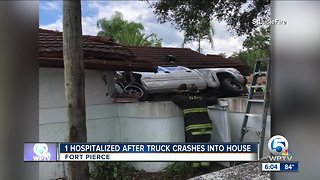 Truck crashes into Fort Pierce house