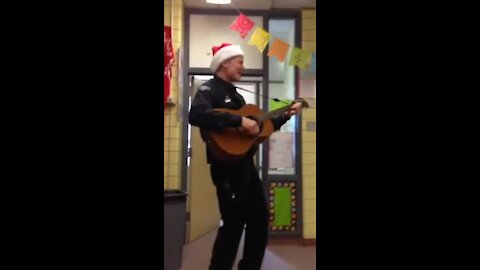 Officer Beesley sings Feliz Navidad