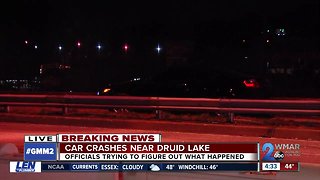 Car crashes into guardrail, almost lands in Druid Lake
