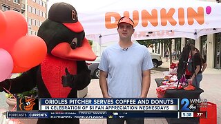 Orioles pitcher serves coffee and donuts to fans