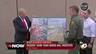 President tours border wall prototypes