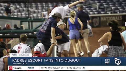 Padres players escort fans into dugout during shooting outside Washington DC ballpark