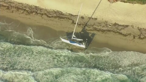 Chopper 5 above abandoned sailboat on Singer Island
