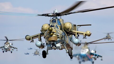 Russian MI-28 And KA-52 Flying Over Troops