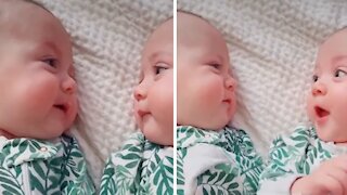 Delightful Moment As Twin Babies Smile At Each Other