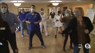 Group of healthcare workers dancing their way into the hearts of seniors at local nursing homes