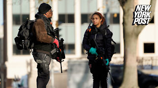 Armed father-daughter duo march alongside anti-Rittenhouse protesters — to protect them