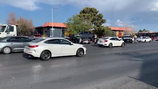 Pickup truck lays on sedan after crash on Eldora and Decatur