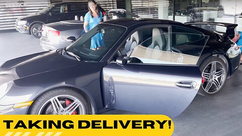 Taking delivery of our first Porsche 911!