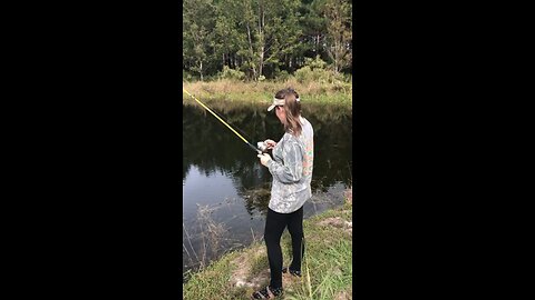 Girl catches a soft shell turtle