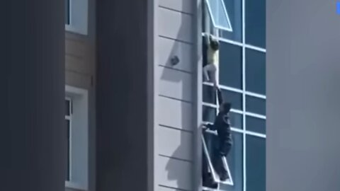 HIGH-RISE HEROISM: Man Saves Child Hanging From A Window