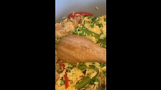 Pork Rice with Green and red pepper, also peas.