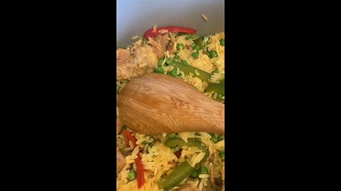 Pork Rice with Green and red pepper, also peas.