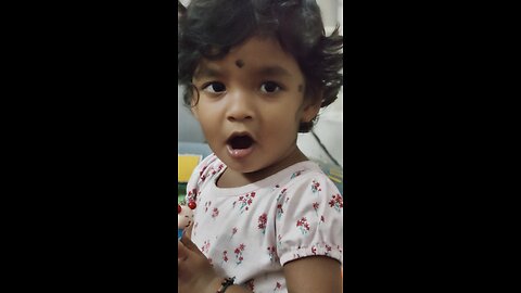 Pretty Girl playing with wooden whistle