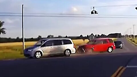 Red SUV ran a stop sign.