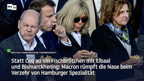 Macron rümpft die Nase beim Verzehr von Hamburger Spezialität