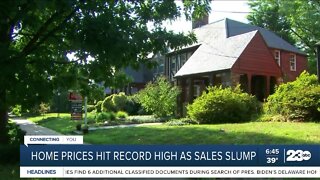 Home prices hit record high as sales slump