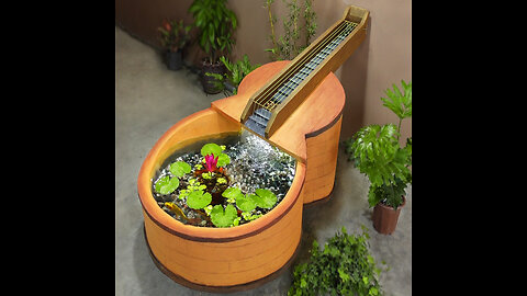 What do you think about amazing aquarium waterfall like the guitar?