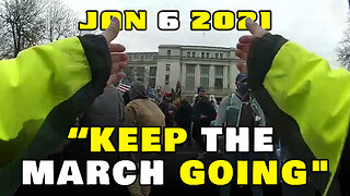 Police officer encouraging protesters to "Keep the march going"