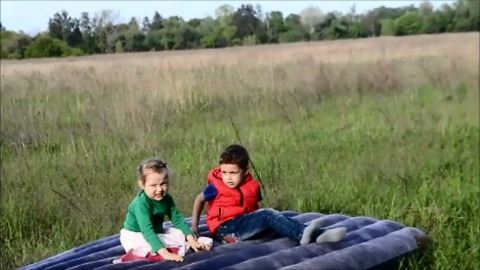 Child learns to do a somersault