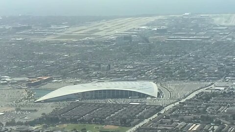 Sofi Stadium flyover cockpit view landing at LAX airport.