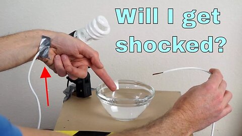 Touching Deionized Water With a Live Wire in It-Will I get Shocked?