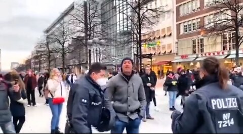 Unmasked German citizen attacked by Police