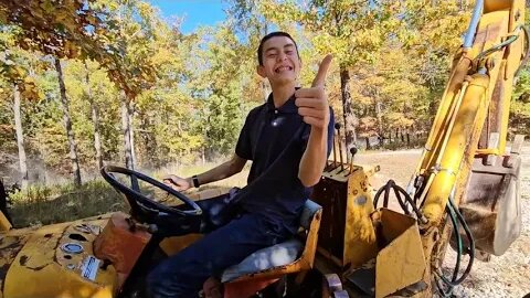 Teaching kids how to drive the old backhoe