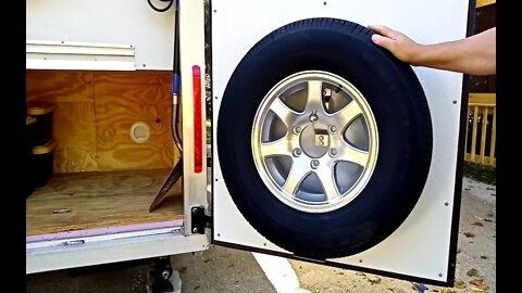 E41 Mounting Tire To Make More Storage – Cargo Trailer To Travel Trailer Conversion