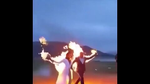Bride and groom set fire to their costumes