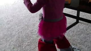 Toddler wears Christmas stockings on her feet