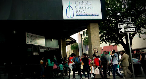 Train of Illegal Immigrants Marches Through McAllen, Gets Free Handouts From Catholic Charity