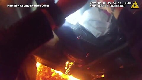 Unconscious woman saved from burning car