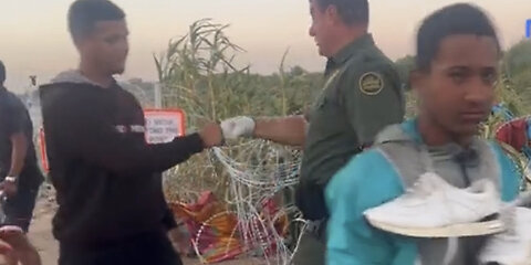 Border Patrol Not only Cuts Razor Wire but Fist Bumps Illegals