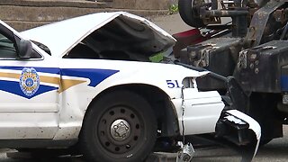 Car crashes into police cruiser leading funeral procession