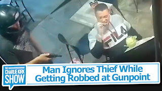 Man Ignores Thief While Getting Robbed at Gunpoint