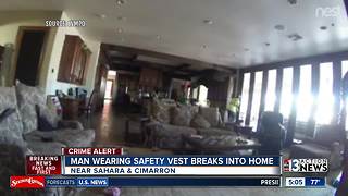 Man in safety vest seen in home