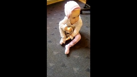 little girl trying to dress up by herself