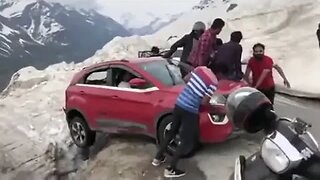 Car almost falls off cliff