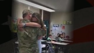 Soldier surprises step-children in school after year-long deployment