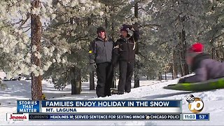 Families enjoy holiday in the snow