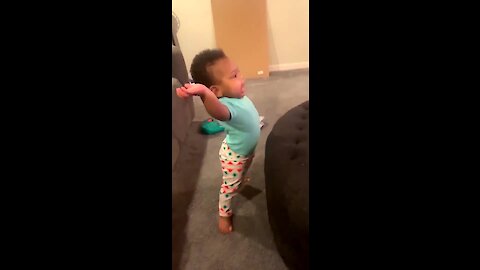 Baby jumps up to dance to favorite tune