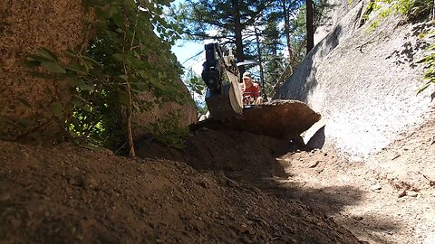 fixing single track, using a rock