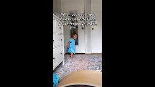 Toddler checks herself out in her new outfit