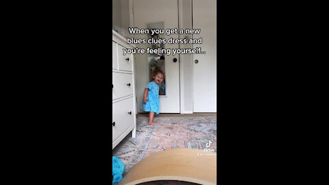 Toddler checks herself out in her new outfit
