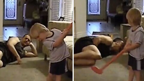 Little boy hurts his dad while playing golf