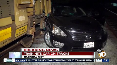 Train hits car on tracks