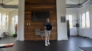 Plate Squat With Knee Drop